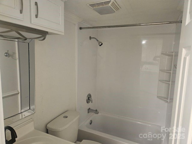 bathroom featuring toilet and bathtub / shower combination