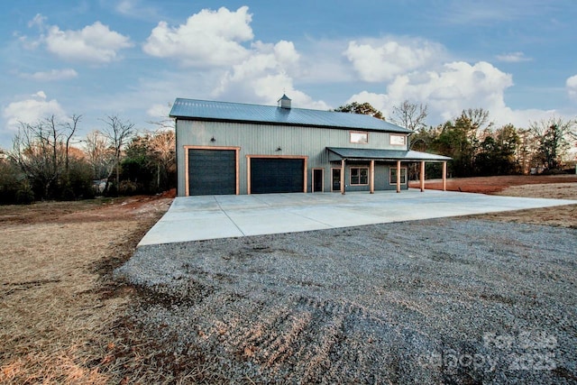 view of front of home with a garage and a porch