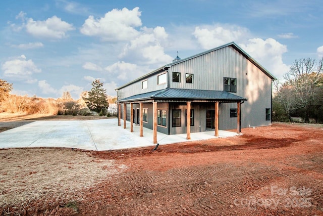 back of house with a patio area