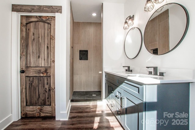 bathroom featuring hardwood / wood-style flooring and vanity