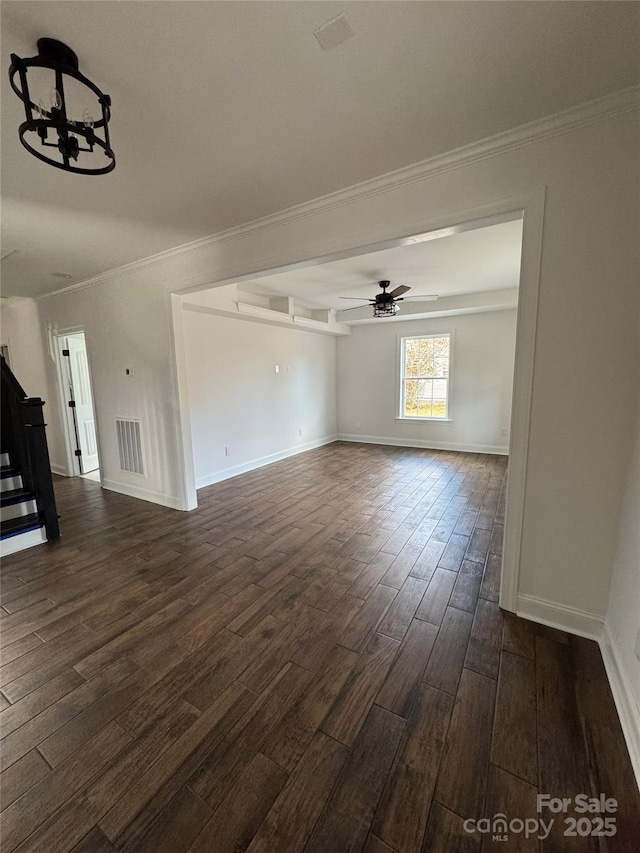 unfurnished living room with ceiling fan, dark hardwood / wood-style flooring, and crown molding