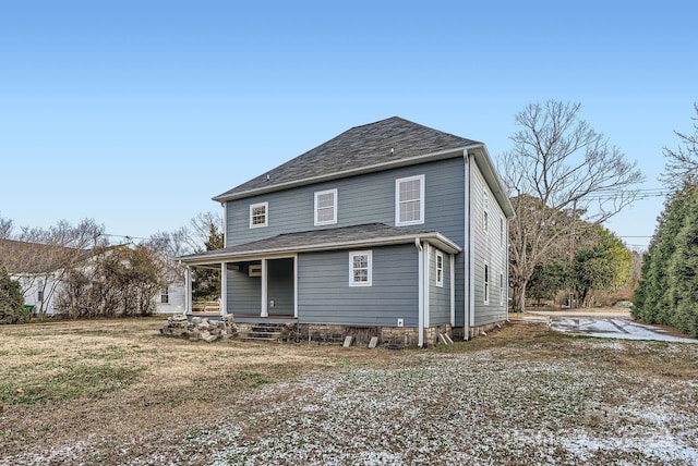 back of house featuring covered porch