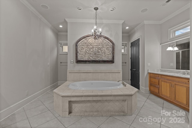 bathroom with a garden tub, tile patterned flooring, crown molding, vanity, and an inviting chandelier