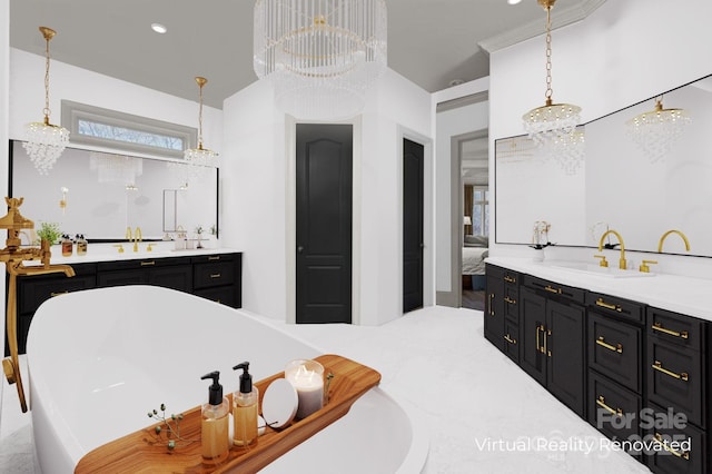 full bathroom with a freestanding bath, vanity, ensuite bath, and an inviting chandelier