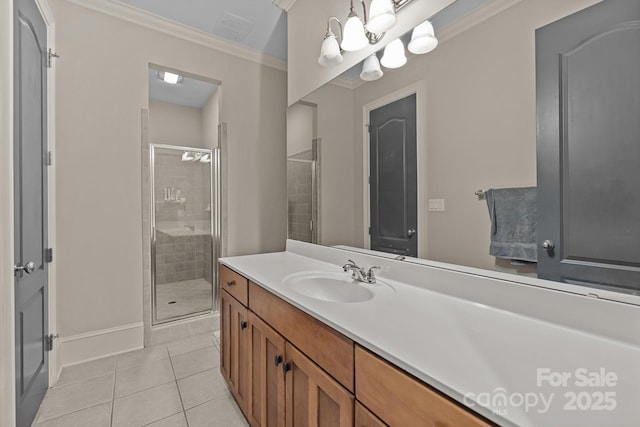 bathroom with ornamental molding, a stall shower, vanity, baseboards, and tile patterned floors