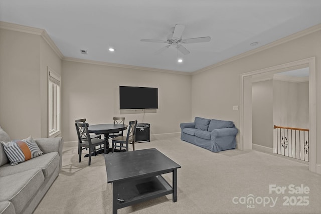 carpeted living area with a ceiling fan, recessed lighting, crown molding, and baseboards