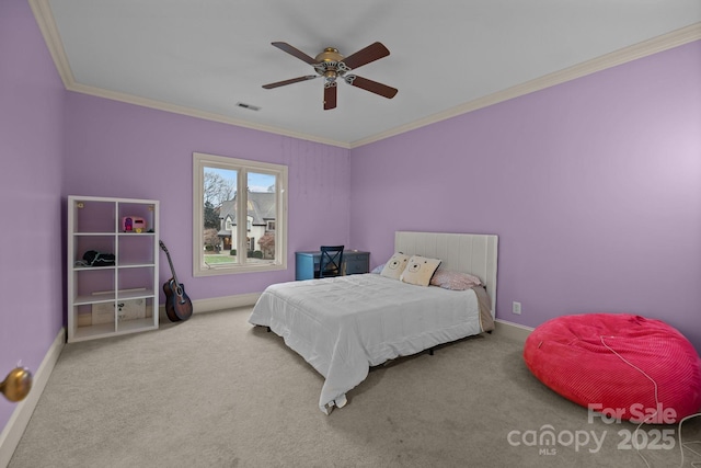 bedroom featuring carpet floors, visible vents, and crown molding