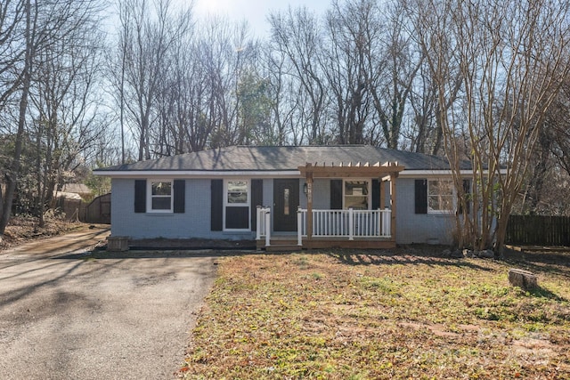 ranch-style home with covered porch