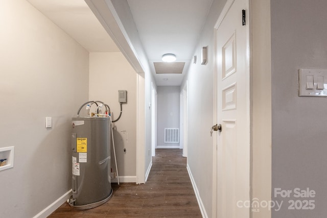 hallway with water heater and dark hardwood / wood-style floors