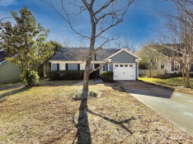 single story home with a front yard and a garage