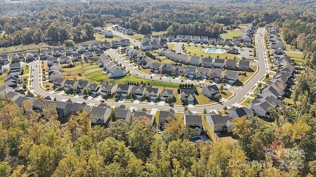 aerial view with a residential view and a view of trees