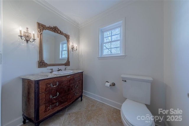 bathroom featuring toilet, ornamental molding, tile patterned floors, and vanity