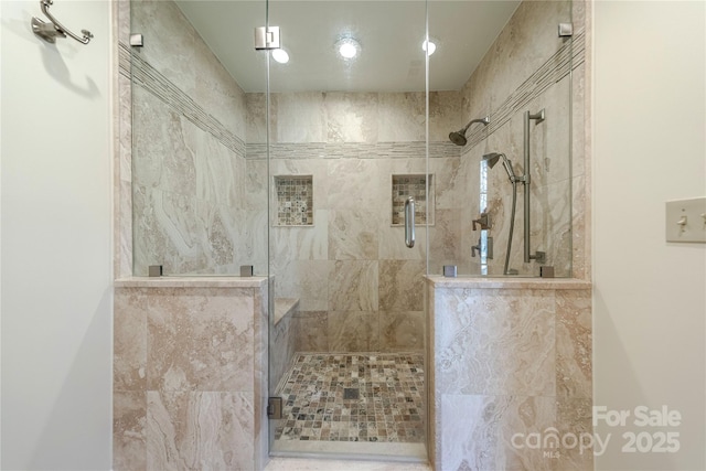 bathroom with a shower with shower door