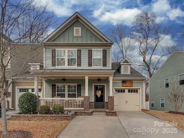 craftsman inspired home with a garage and covered porch