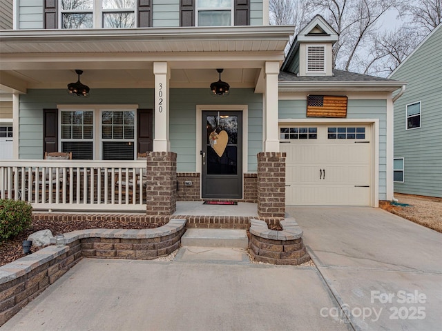 property entrance featuring a porch and a garage