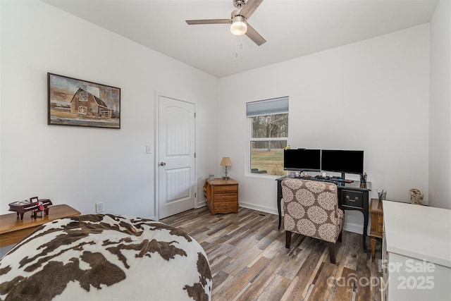 bedroom featuring a ceiling fan and wood finished floors