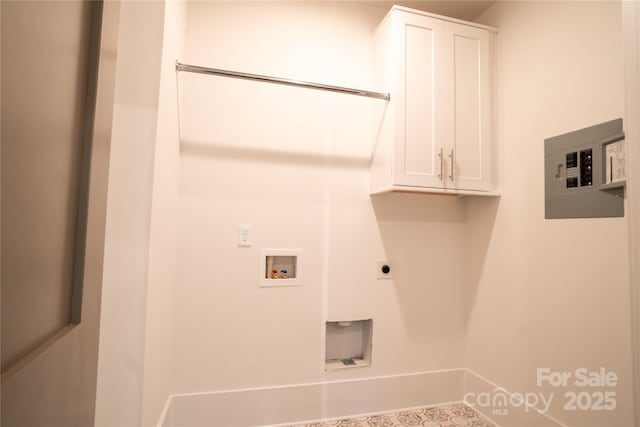 clothes washing area with cabinets, electric panel, hookup for a washing machine, and hookup for an electric dryer