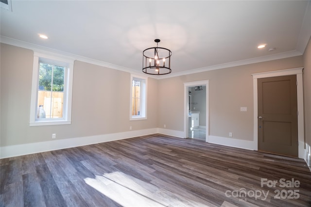 interior space featuring dark wood-type flooring, an inviting chandelier, and crown molding