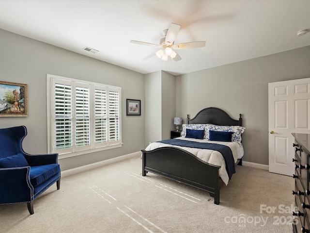 bedroom with baseboards, visible vents, light carpet, and a ceiling fan