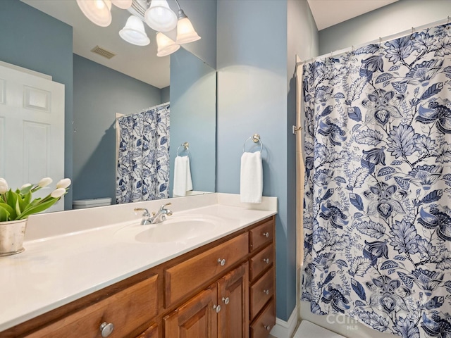 full bath featuring visible vents, toilet, and vanity