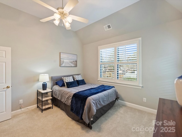 bedroom with baseboards, visible vents, light colored carpet, and lofted ceiling