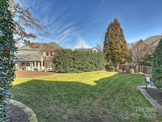 view of yard with fence