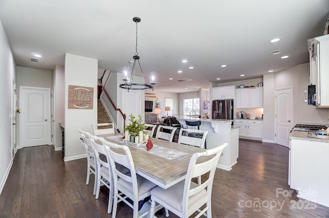 dining space with dark hardwood / wood-style floors