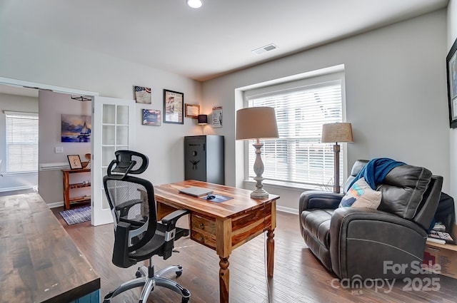 home office with hardwood / wood-style floors