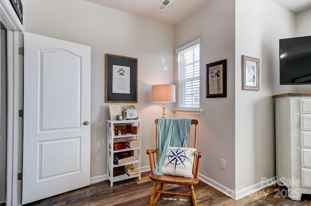 living area with dark hardwood / wood-style floors