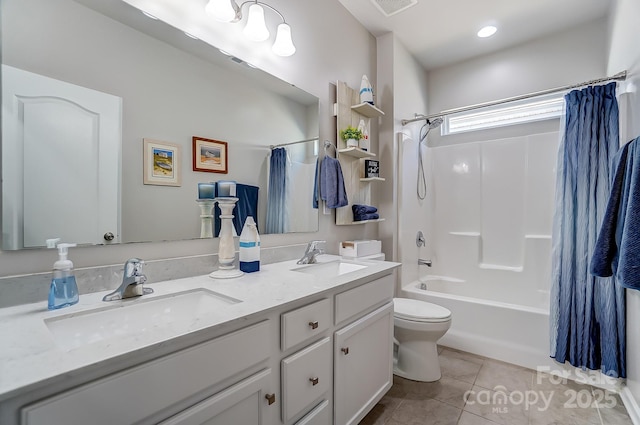 full bathroom with shower / bath combo, toilet, tile patterned floors, and vanity