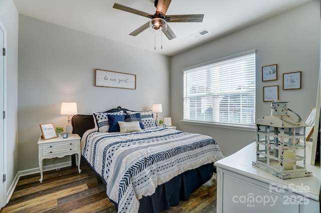 bedroom featuring ceiling fan and dark hardwood / wood-style floors