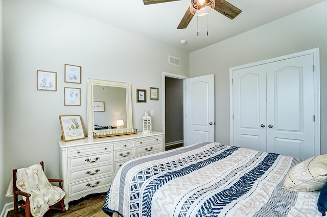 bedroom featuring a closet, ceiling fan, and dark hardwood / wood-style flooring