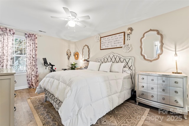 bedroom featuring ceiling fan and light hardwood / wood-style flooring