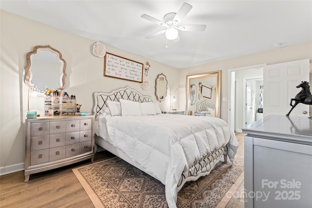 bedroom featuring wood-type flooring and ceiling fan