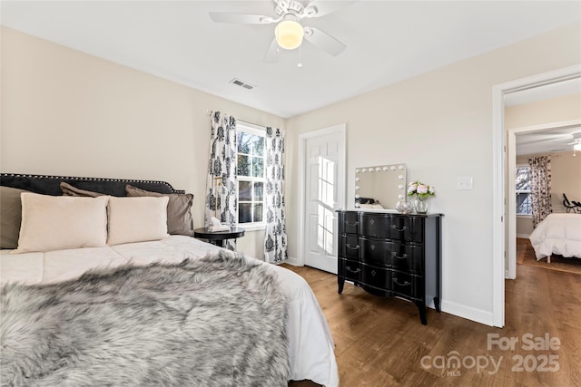 bedroom featuring dark wood-type flooring and ceiling fan