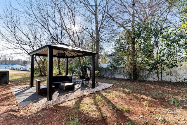 view of yard featuring a gazebo and central AC unit