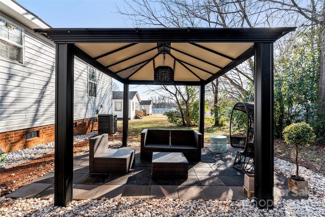 view of patio / terrace featuring an outdoor living space, a gazebo, and cooling unit