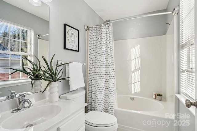 full bathroom featuring toilet, vanity, and shower / bath combo