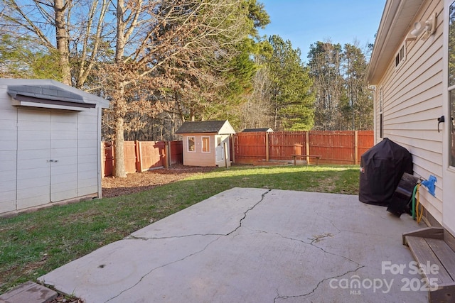 view of patio / terrace with grilling area and a storage unit