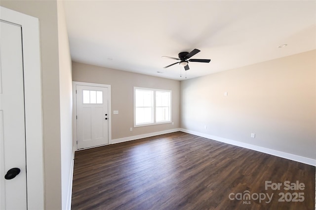 entrance foyer with dark wood-style floors, baseboards, and a ceiling fan