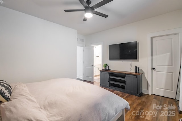 bedroom with ceiling fan and dark hardwood / wood-style floors