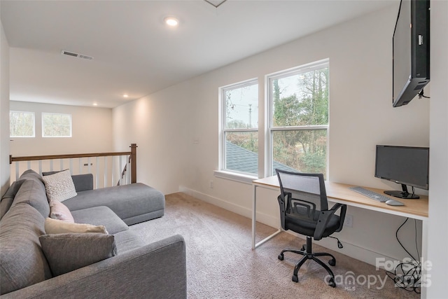 office space with light colored carpet