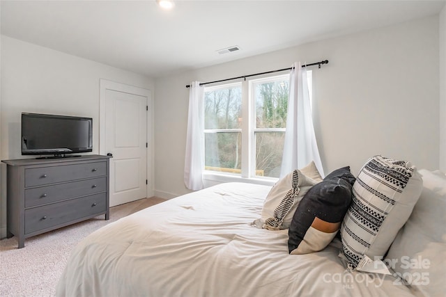 bedroom with light carpet