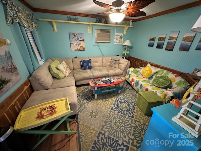 carpeted living room with ceiling fan, ornamental molding, and a wall mounted air conditioner