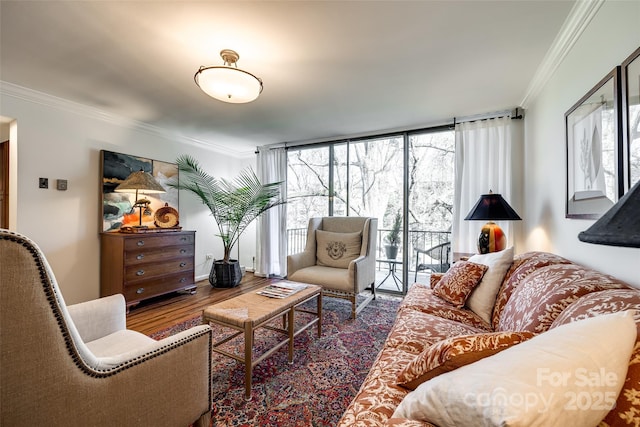 living room with hardwood / wood-style floors, crown molding, and expansive windows