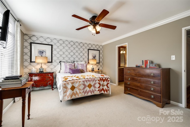 carpeted bedroom with ornamental molding and ceiling fan