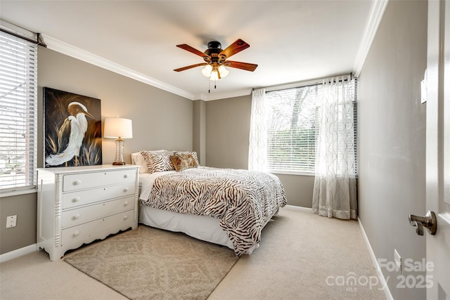 bedroom with multiple windows, crown molding, light carpet, and ceiling fan