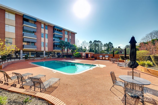 view of swimming pool featuring a patio area