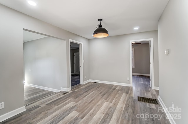 spare room featuring hardwood / wood-style floors