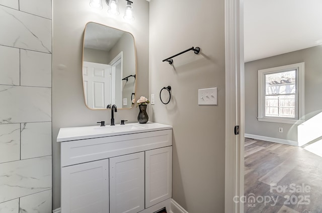 bathroom featuring hardwood / wood-style flooring and vanity